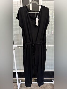 Size XL Pretty Garden black jumper with jogger cuffs at ankle. NWT!
